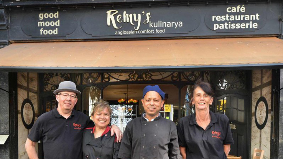 The Remy's Family standing in front of the cafe Remy’s Café Kulinarya, on Kings Road, St. Leonards on Sea, East Sussex. Article Philippine Restaurant wins UK Award by MY RANGGO Hospitality Magazine