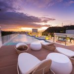 Rooftop swimming pool lit by a beautiful sunset, at Ferra Hotel Boracay