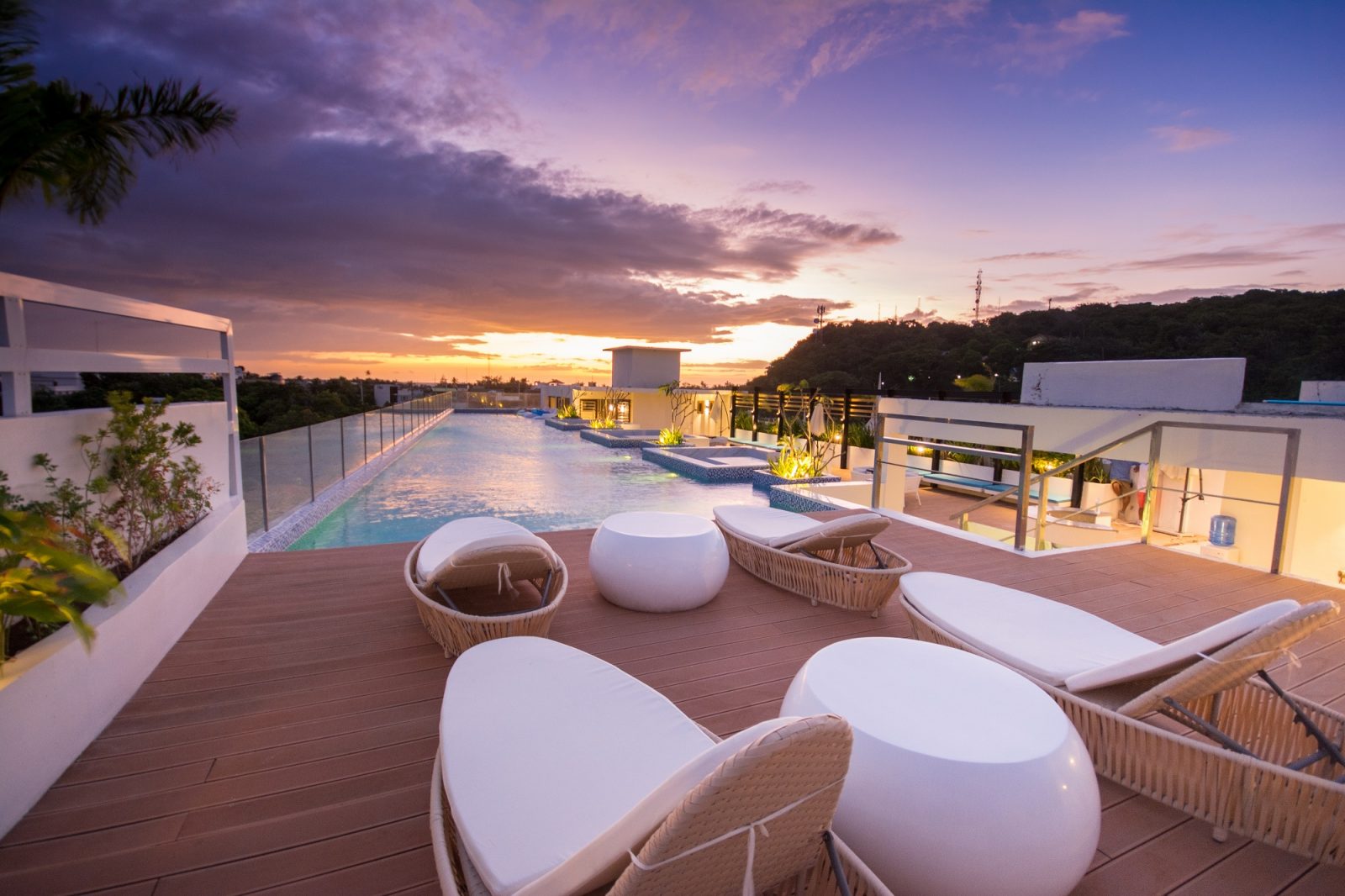 Rooftop swimming pool lit by a beautiful sunset, at Ferra Hotel Boracay