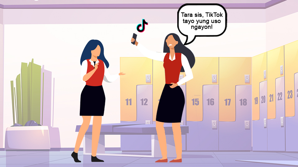 two female hoteliers in the locker room, one is making a TikTok post