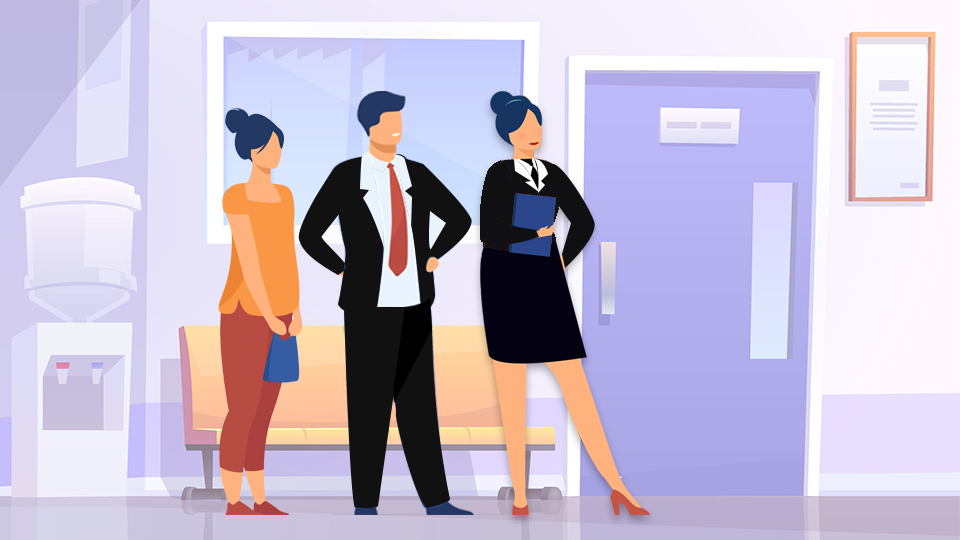 Three people lined up outside a meeting room waiting for an interview. One male and one female are dressed in suits, the 2nd female is just wearing casual clothes. Hotel Interview Dress Code: Get Hired Series (Part 2)